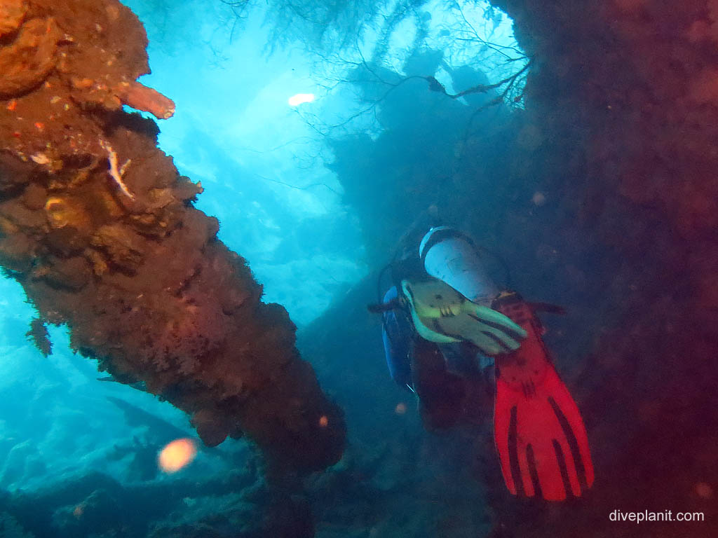 Heading down through the wreck at I-1 Submarine diving Honiara in the Solomon Islands by Diveplanit