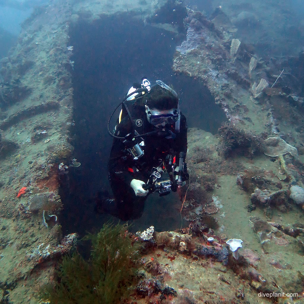 Deb rises from the crack in the hull at I-1 Submarine diving Honiara in the Solomon Islands by Diveplanit