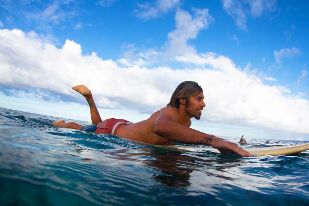 Professional surfer Dave Rastovich surfs the Reef. Photo by Samuel Hall.