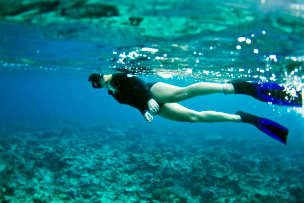 One of team marvels at the Reef's beauty. Photo by Samuel Hall.