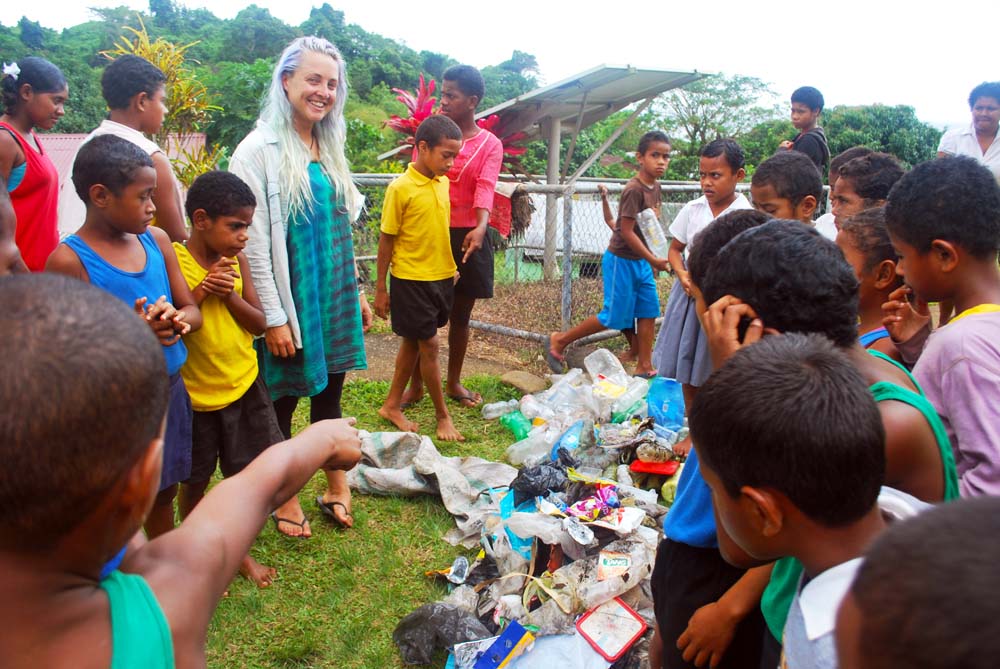 Diveplanit blogger Alice Forrest leading Fijian school kids on their first clean up day.