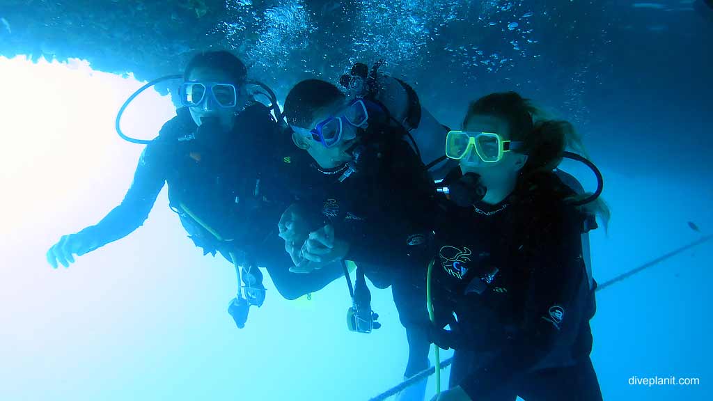 Divers setting off from the dive platform at Reefworld Pontoon diving Whitsundays