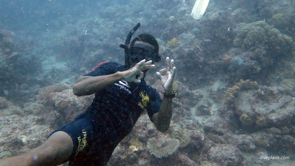 One of the guides having a snorkel at 13m! diving Two Bommies of Ifira Island at Port Vila diving Vanuatu by Diveplanit