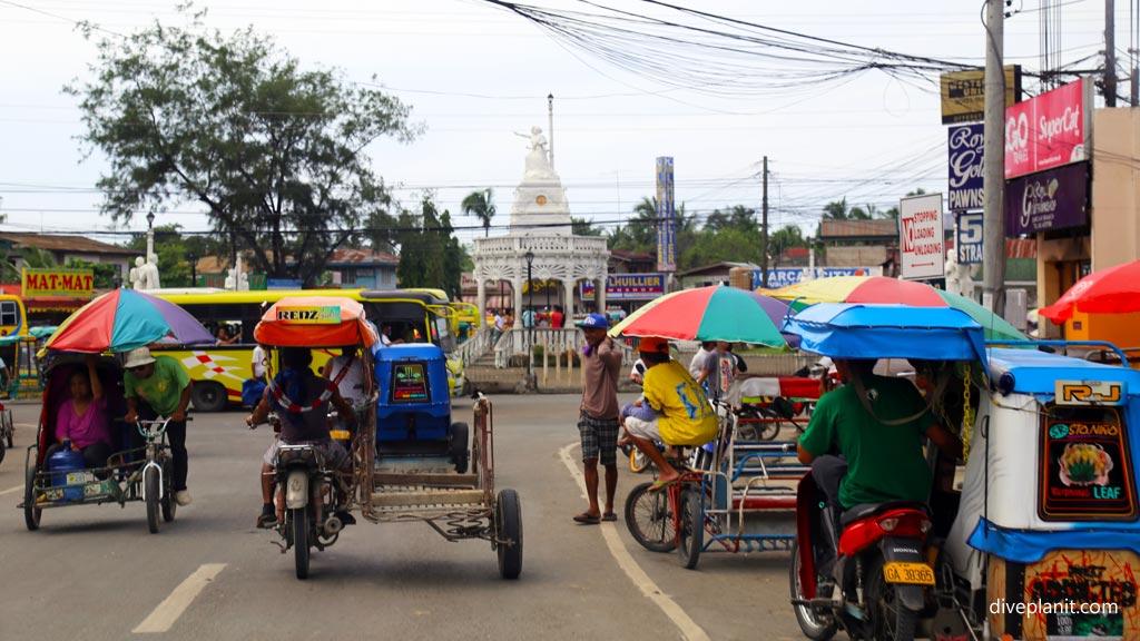 Tricycles and motor tricycles at the roadside in Cebu diving the Philippines in the Philippines by Diveplanit