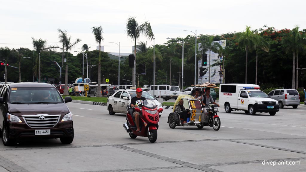 Different forms of transport at an intersection in Manila diving the Philippines in the Philippines by Diveplanit