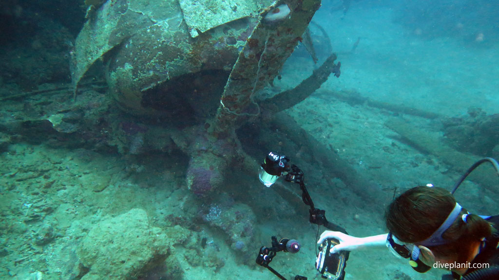 Photographer checking they got that shot of the propellor at Catalina Wreck diving Tulagi in the Solomon Islands by Diveplanit