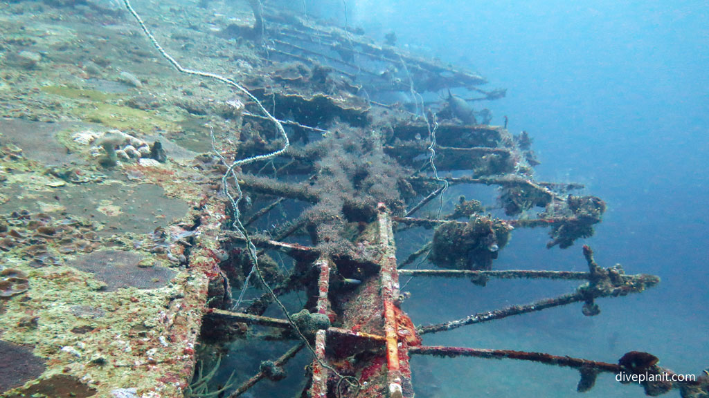 Traversing back along the rear of the port wing at Catalina Wreck diving Tulagi in the Solomon Islands by Diveplanit
