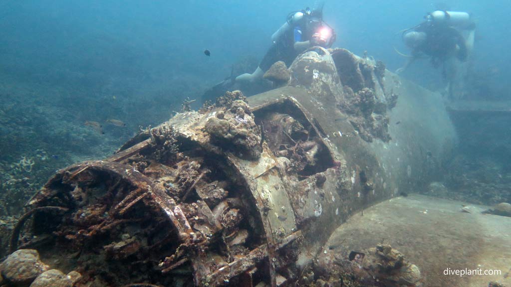 Diver above the wreck at Hellcat Wreck diving Gizo in the Gizo by Diveplanit
