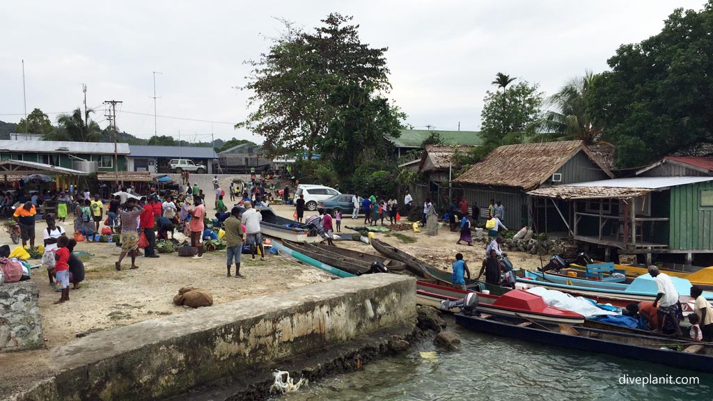 Villagers arrive diving Munda at the Markets in the Solomon Islands by Diveplanit