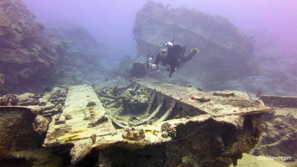 Diver on the wreck at Mataora Wreck diving Rarotonga in the Cook Islands by Diveplanit