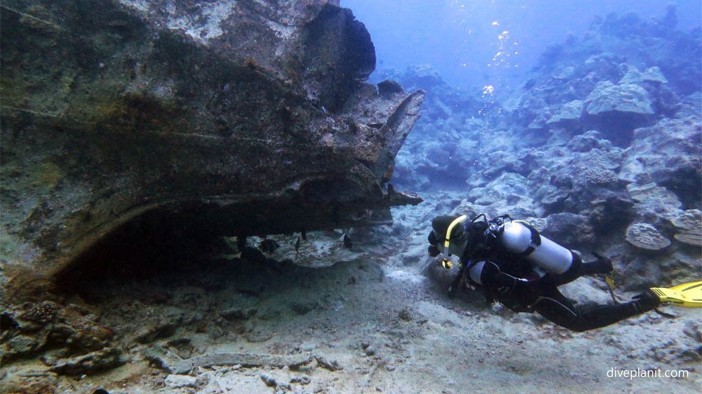 Diver amongst the wreckage diving Rarotonga at Mataora Wreck in the Cook Islands by Diveplanit