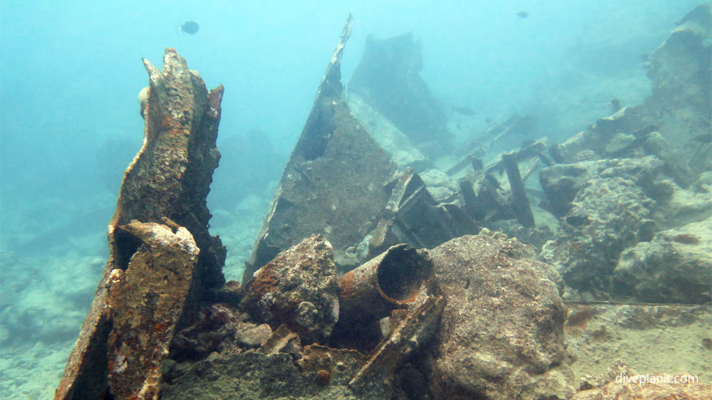 Along the wreckage at Mataora Wreck diving Rarotonga in the Cook Islands by Diveplanit
