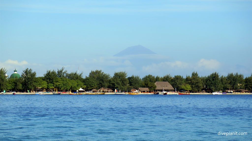 View across to Gili Trawangan with Balis Gunung Agung in the background diving Gili Islands Lombok Indonesia by Diveplanit