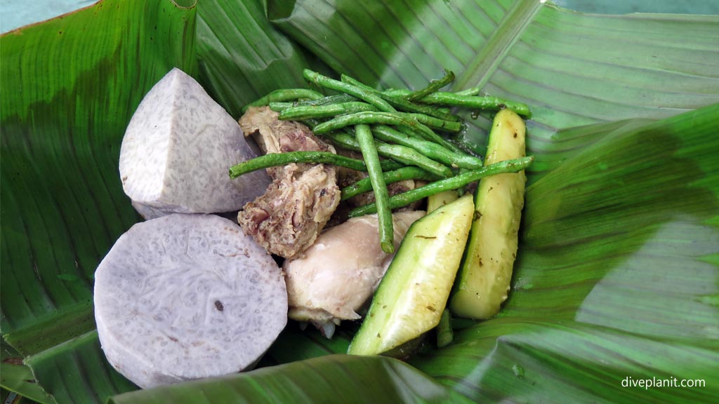 Umu lunch served on banana leaves in a basket at the village in Aunuu American Samoa by Diveplanit