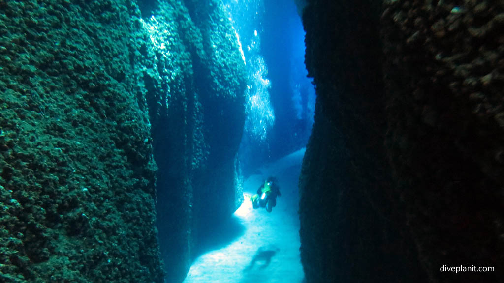 Exiting the cut diving Leru Cut at Russell Islands Solomon Islands by Diveplanit