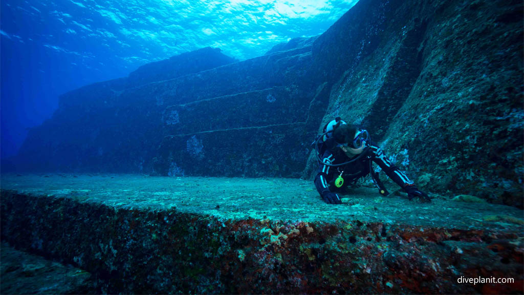 Steps in the background at Monument diving Yonaguni Okinawa Japan by Diveplanit