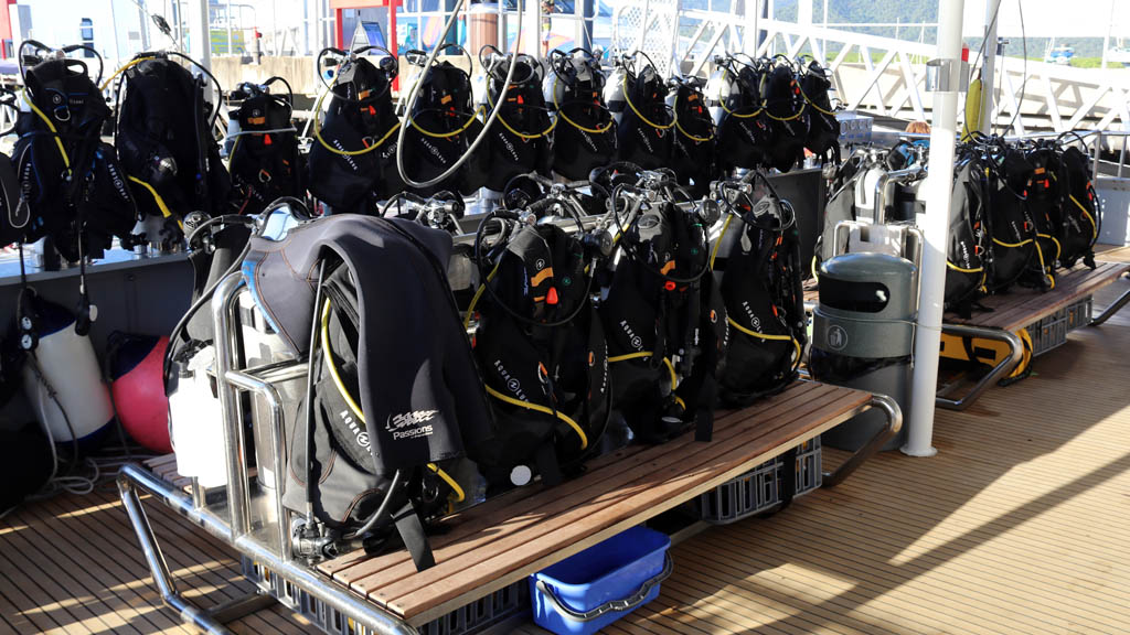 Dive deck with rows of new gear at Passions of Paradise diving Hastings Reef Great Barrier Reef Queensland by Diveplanit