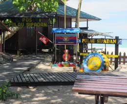 Colourful signage of kompeni charlie at the island diving sipadan malaysia feature
