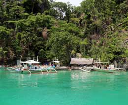 Boats on a day trip at kayangan lake diving coron palawan philippines feature