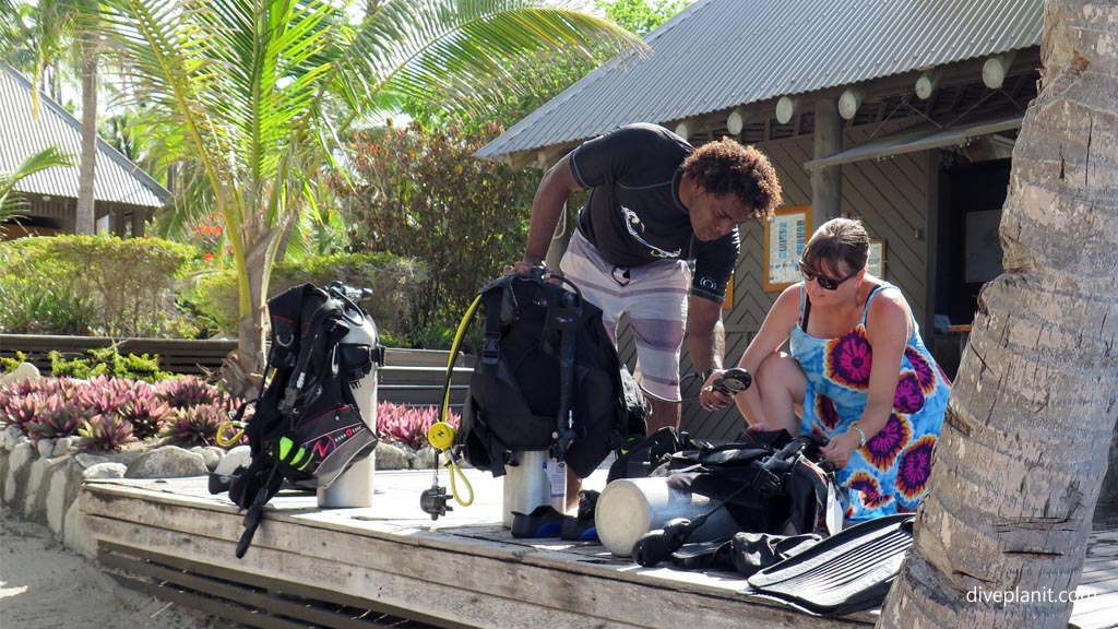 Vili and Deb check the gear diving Vomo with Vomo Island Resort PADI dive centre in the Fiji Islands by Diveplanit