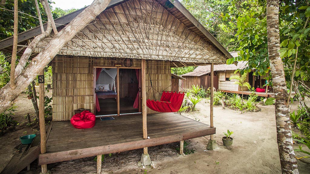 Biodiversity eco resort gam island raja ampat indonesia deluxe cabin on the beach