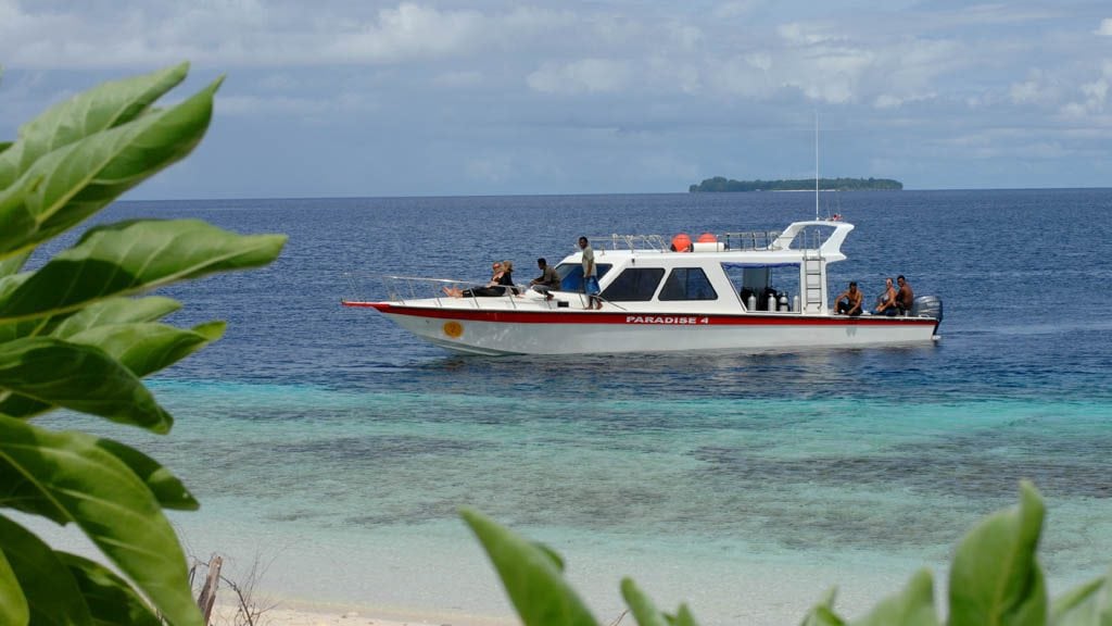 Papua paradise eco resort raja ampat indonesia dive boat coming ashore