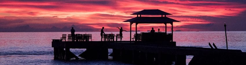 Sunset at wakatobi jetty bar banner