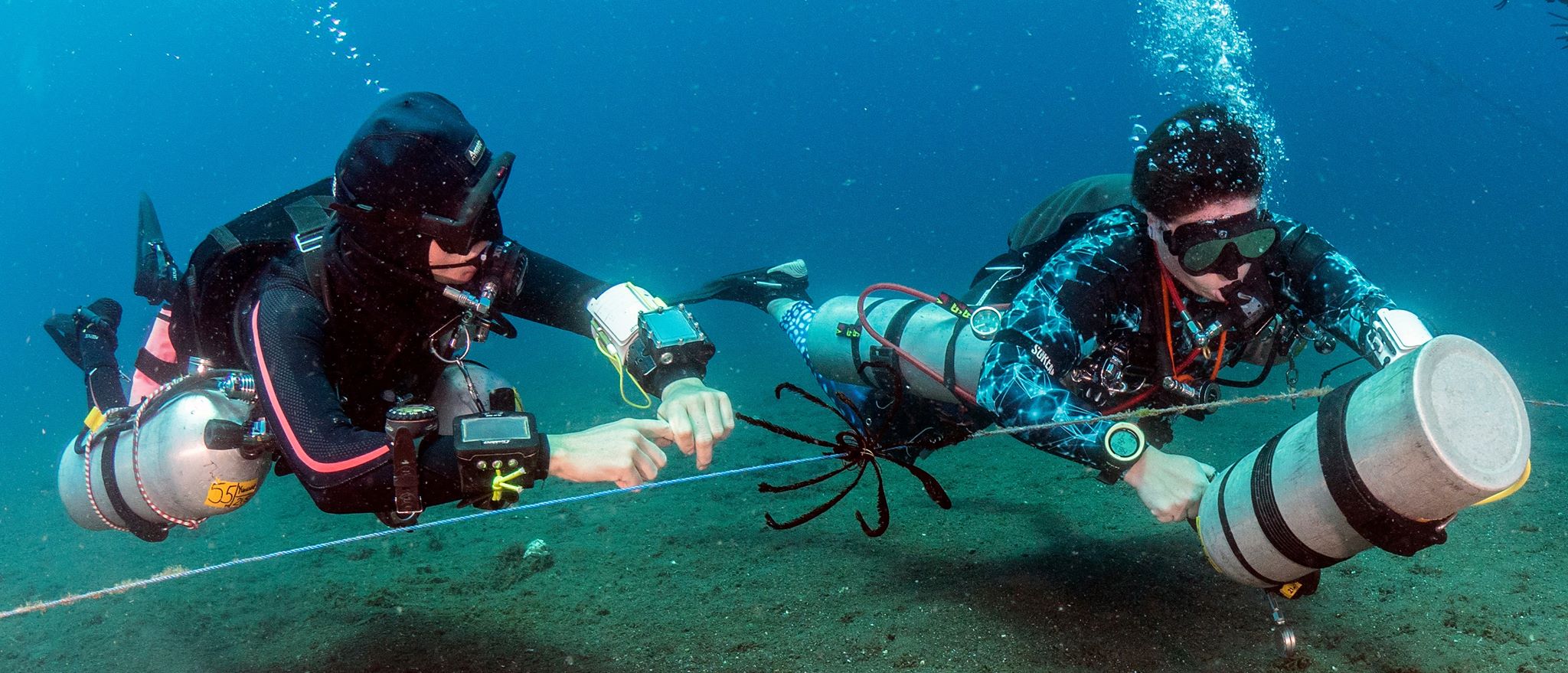 Tech diving introduction instructor Yvonne Press with diver above coral credit Jon Piepkorn