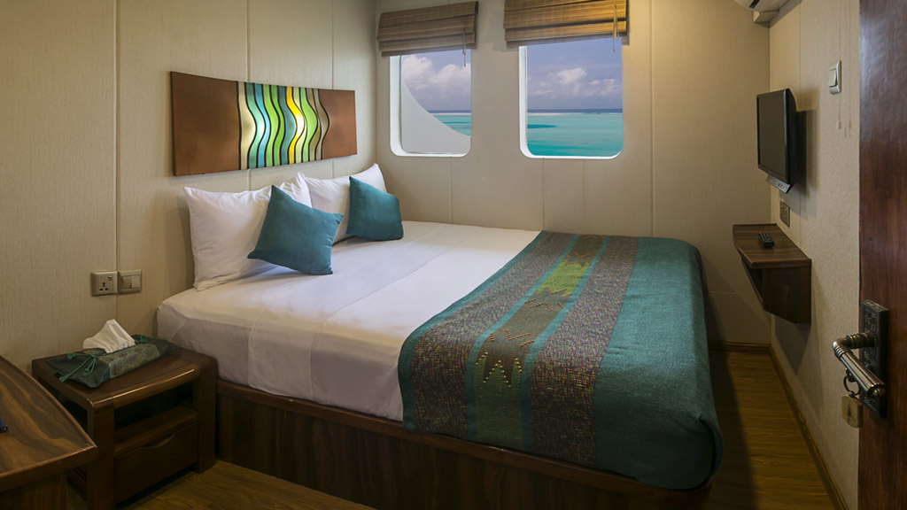 Sea and Sand double cabins have queen size double beds, TV and a window view.